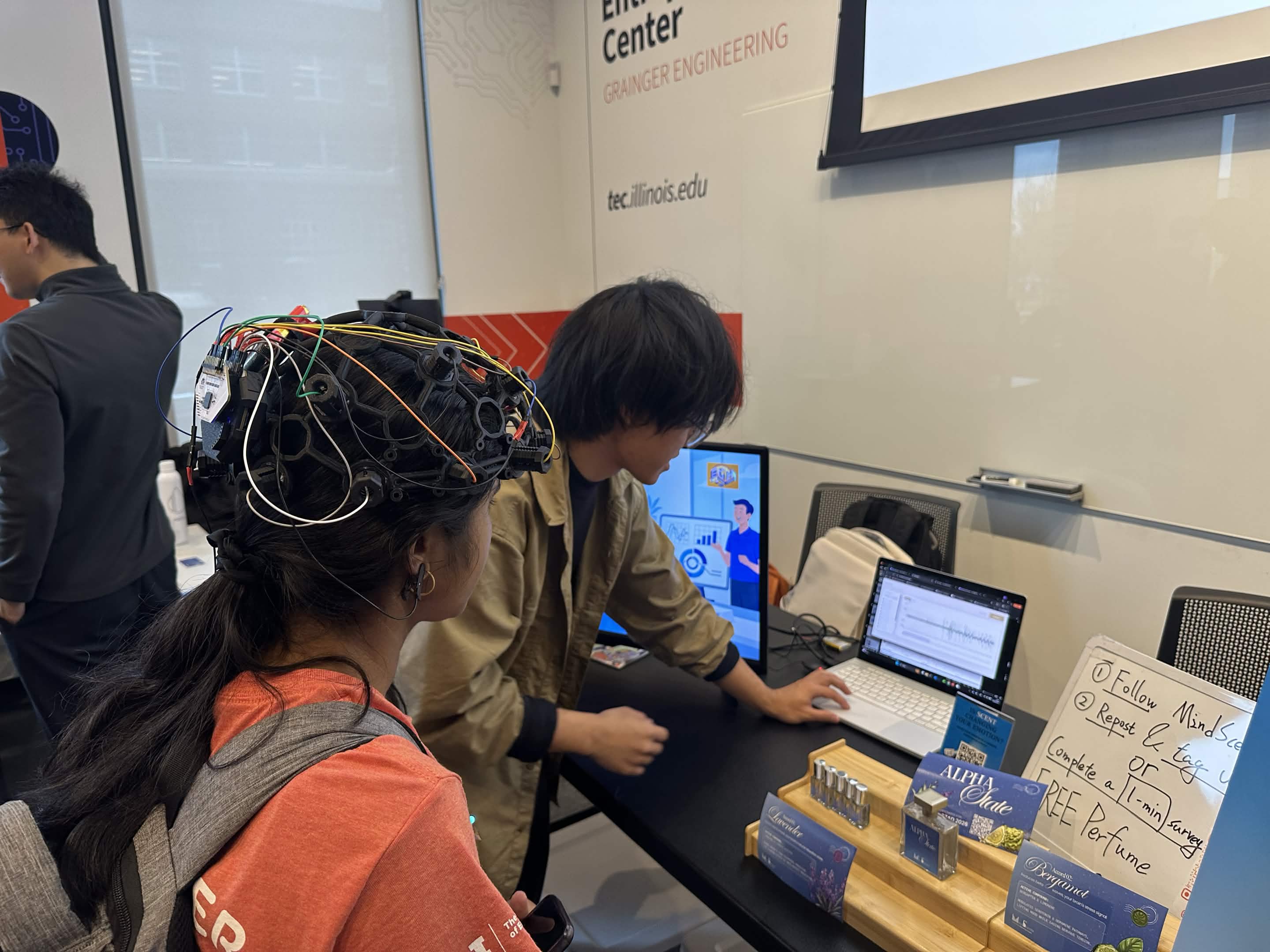 MindScents demonstration at UIUC Engineering Open House with a participant viewing a live signal display